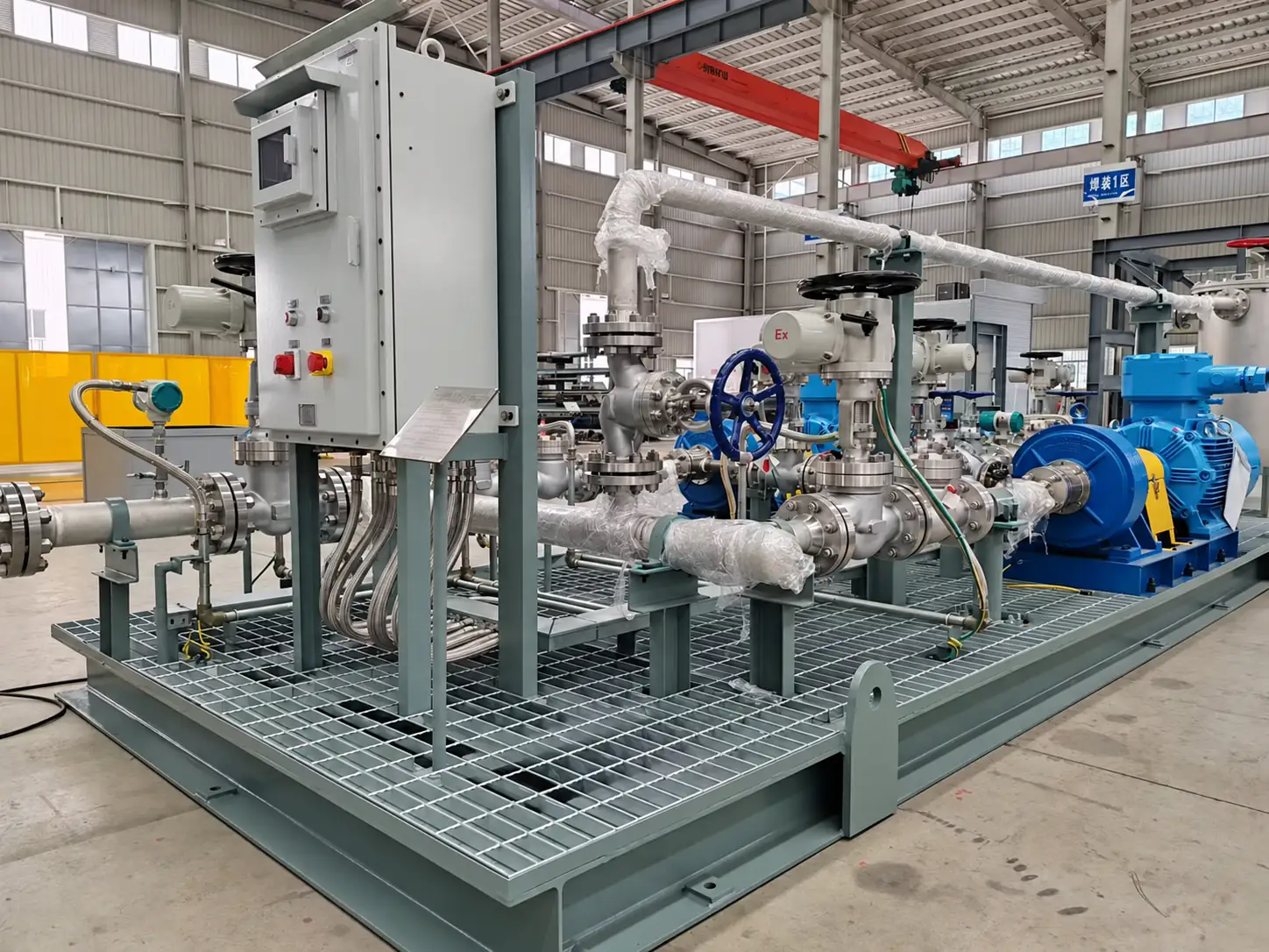 Complete EHIK integrated pump skid showing the control cabinet, piping, valves, instruments, pump set and shared base